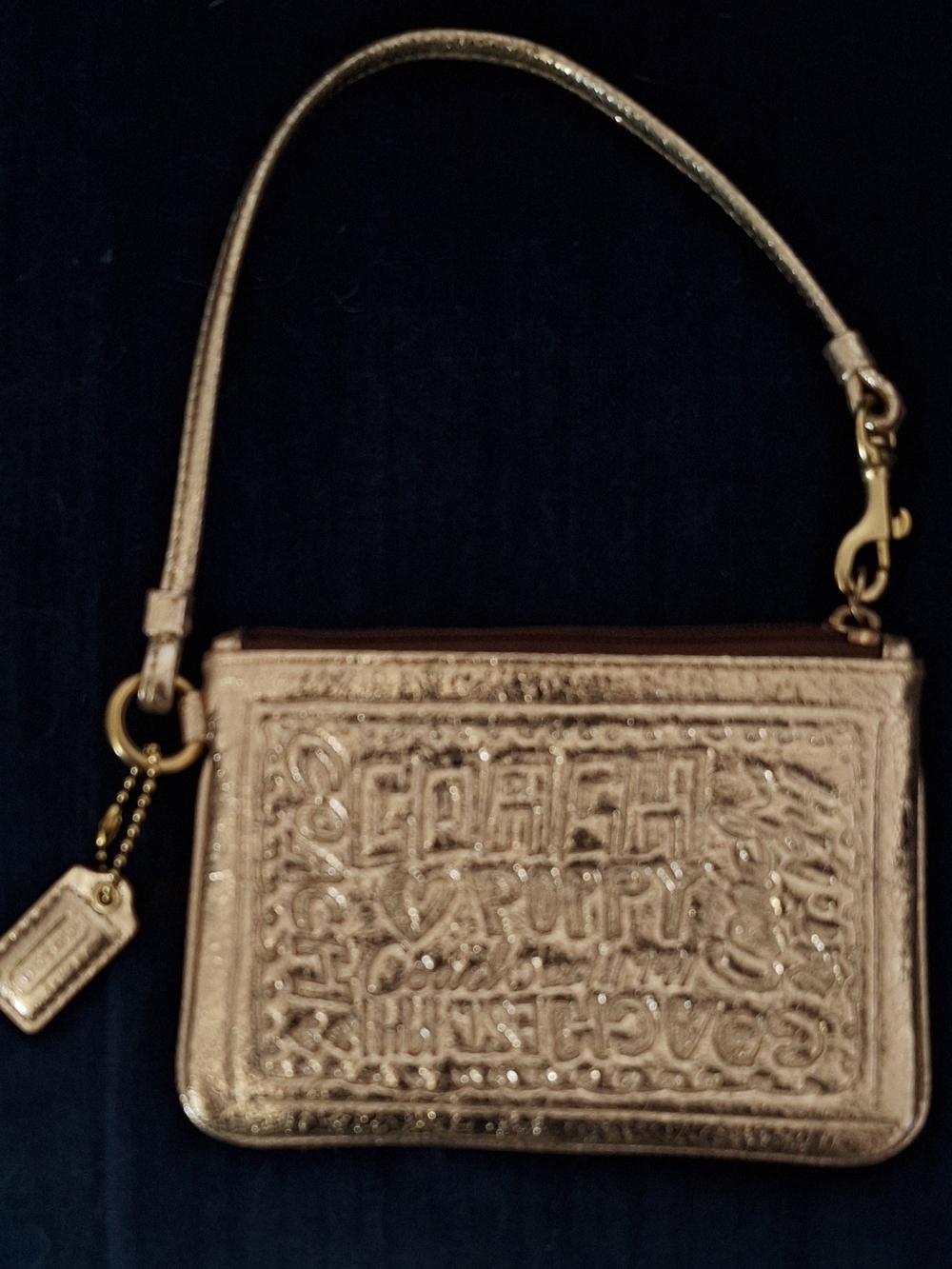 Coach Metallic Rose Gold Embossed Wristlet with Charm